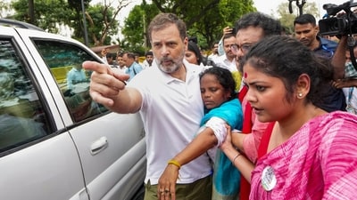 Congress leader Rahul Gandhi and other members attend to TMC MP Mitali Bag, who fainted during a protest march by the INDIA bloc from Parliament to the Election Commission office in New Delhi on Monday, August 11. (PTI) Congress leader Rahul Gandhi and other members attend to TMC MP Mitali Bag, who fainted during a protest march by the INDIA bloc from Parliament to the Election Commission office in New Delhi on Monday, August 11. (PTI)