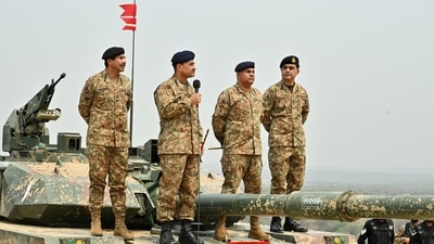 File photo: Chief of Army Staff of Pakistan Asim Munir holds a microphone during his visit at the Tilla Field Firing Ranges (TFFR) (REUTERS)