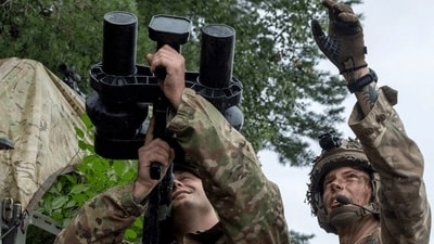 A member of the U.S. Army is shown how to use a portable electronic jammer by a British soldier during the Project Flytrap 4.0 exercise in Poland. A member of the U.S. Army is shown how to use a portable electronic jammer by a British soldier during the Project Flytrap 4.0 exercise in Poland.