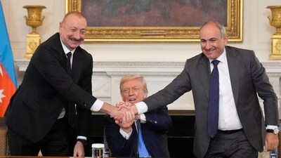 President Donald Trump, center, shakes hands with Armenian Prime Minister Nikol Pashinyan, right, and Azerbaijan President Ilham Aliyev during a trilateral signing ceremony in the State Dining Room of the White House, Friday, Aug. 8, 2025, in Washington. (AP)