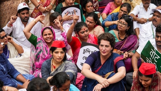 Congress MP Priyanka Gandhi Vadra, Samajwadi Party MP Dimple Yadav, TMC MP Saayoni Ghosh, with others, sitting in a protest march over poll fraud.(PTI)