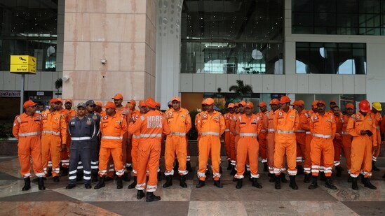 A team of National Disaster Response Force (NDRF) officials were briefed before heading out for rescue operations after flash floods in Dharali village.(Reuters)