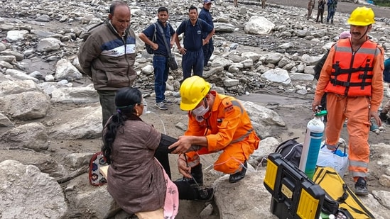 NDRF personnel are seen conducting a medical evaluation during a rescue and relief operation at the disaster-hit Dharali after the recent flash floods, in Uttarakhand's Uttarkashi.(PTI)