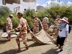 Armed forces personnel cleaning up Indus river in Leh on Tuesday. (HT Photo)