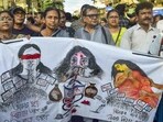 Doctors and others take part in a protest rally to mark one year of the rape and murder of a trainee doctor at the RG Kar Medical College and Hospital, in Kolkata