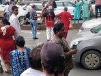 Protesters briefly stopped traffic on the Solapur Highway near Fatimanagar and forcefully crossed the road to highlight the dangers faced by pedestrians since the junction was closed. (HT Photo) Protesters briefly stopped traffic on the Solapur Highway near Fatimanagar and forcefully crossed the road to highlight the dangers faced by pedestrians since the junction was closed. (HT Photo)