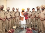 The promoted police officers with Punjab chief minister Bhagwant Mann. (HT) The promoted police officers with Punjab chief minister Bhagwant Mann. (HT)