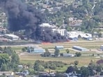 Smoke rises following a plane crash at Kalispell City Airport, in Kalispell, Montana, US, August 11. 