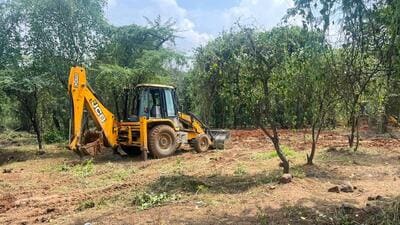 Activists allege eight to ten earthmoving machines have been deployed in the site. (Parveen Kumar/HT Photo) Activists allege eight to ten earthmoving machines have been deployed in the site. (Parveen Kumar/HT Photo)