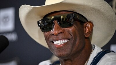 Deion Sanders smiles before speaking about his journey in beating bladder cancer during a press conference on July 28. (AP) Deion Sanders smiles before speaking about his journey in beating bladder cancer during a press conference on July 28. (AP)
