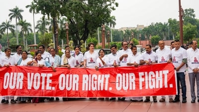 Members of the INDIA bloc hold a banner that reads ‘Our vote. Our right. Our fight,’ as they stage a protest over 'poll fraud' issues during today's parliament session. (Ravi Choudhary/PTI) Members of the INDIA bloc hold a banner that reads ‘Our vote. Our right. Our fight,’ as they stage a protest over 'poll fraud' issues during today's parliament session. (Ravi Choudhary/PTI)