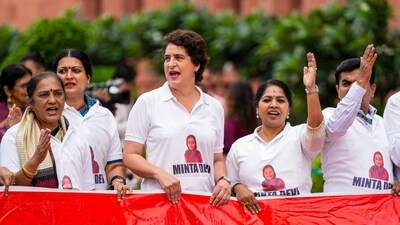 Congress MP Priyanka Gandhi Vadra and other INDIA bloc members wore T-shirts featuring the name Minta Devi, a voter allegedly listed as 124 years, as they protested in Parliament on Tuesday, Aug 12. (Ravi Choudhary/PTI) Congress MP Priyanka Gandhi Vadra and other INDIA bloc members wore T-shirts featuring the name Minta Devi, a voter allegedly listed as 124 years, as they protested in Parliament on Tuesday, Aug 12. (Ravi Choudhary/PTI)