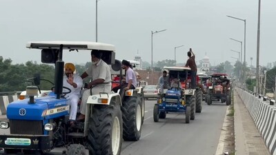 Farmers participating in a tractor rally, demanding official withdrawal of the land pooling policy, in Sangrur’s Dhuri on Tuesday. (HT) Farmers participating in a tractor rally, demanding official withdrawal of the land pooling policy, in Sangrur’s Dhuri on Tuesday. (HT)