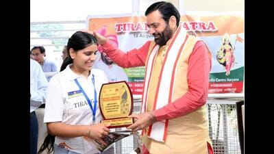 Haryana chief minister Nayab Singh Saini felicitating a student during the flagging off of the “Tiranga Yatra”from Chandigarh on Tuesday and will end at Kashmir’s Lal Chowk on August 18. (Sourced)