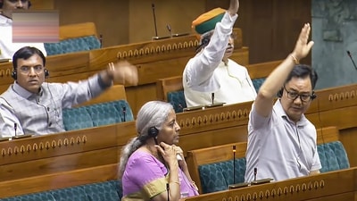 Union Ministers Nirmala Sitharaman, Kiren Rijiju and Mansukh Mandaviya during voting in the Lok Sabha on the withdrawal of the Income Tax Bill 2025 at the Monsoon session of Parliament. (Sansad TV) Union Ministers Nirmala Sitharaman, Kiren Rijiju and Mansukh Mandaviya during voting in the Lok Sabha on the withdrawal of the Income Tax Bill 2025 at the Monsoon session of Parliament. (Sansad TV)