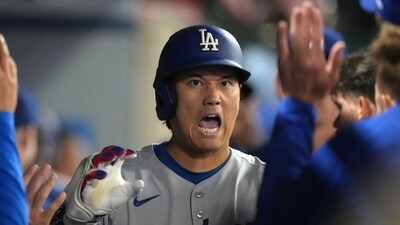 Los Angeles Dodgers designated hitter Shohei Ohtani (17) celebrates with teammates after hitting a home run (IMAGN IMAGES via Reuters Connect)