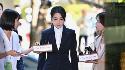 South Korea's former first lady Kim Keon Hee, center, wife of impeached former president Yoon Suk Yeol, arrives at a court to attend a hearing in Seoul, South Korea, Tuesday, Aug. 12, 2025. (AP)