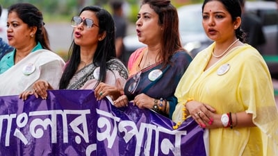 TMC MPs Mahua Moitra, Satabdi Roy, June Maliah and others hold a banner that partially reads ‘Banglar opoman’ (Bangla's insult) as they protest at today's Parliament session over the alleged insult to Bengal. (Ravi Choudhary/PTI) TMC MPs Mahua Moitra, Satabdi Roy, June Maliah and others hold a banner that partially reads ‘Banglar opoman’ (Bangla's insult) as they protest at today's Parliament session over the alleged insult to Bengal. (Ravi Choudhary/PTI)