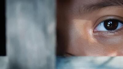 The blank stare of a child's eye who is standing behind what appears to be a wooden frame (Getty Images) The blank stare of a child's eye who is standing behind what appears to be a wooden frame (Getty Images)