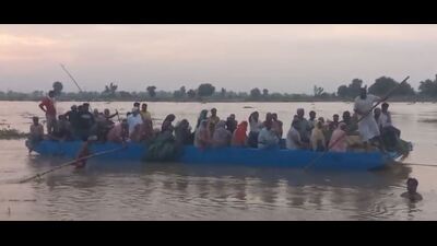 The villagers adrift a boat while crossing Sutlej in Ferozepur district,