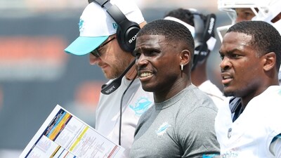 Tyreek Hill #10 of the Miami Dolphins looks on from the side line during the first quarter vs Bears (Getty Images via AFP) Tyreek Hill #10 of the Miami Dolphins looks on from the side line during the first quarter vs Bears (Getty Images via AFP)