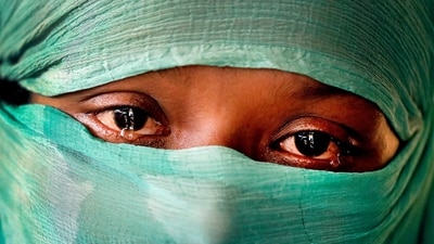 In this Wednesday, Nov. 22, 2017, photo, F, 22, who says she was raped by members of Myanmar's armed forces in June and again in September, is photographed in her tent in Kutupalong refugee camp in Bangladesh. (AP) In this Wednesday, Nov. 22, 2017, photo, F, 22, who says she was raped by members of Myanmar's armed forces in June and again in September, is photographed in her tent in Kutupalong refugee camp in Bangladesh. (AP)