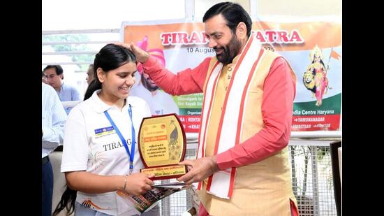 Haryana chief minister Nayab Singh Saini felicitating a student during the flagging off of the “Tiranga Yatra”from Chandigarh on Tuesday and will end at Kashmir’s Lal Chowk on August 18. (Sourced)