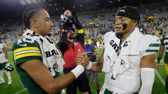 Green Bay Packers' Jordan Love talks to New York Jets' Justin Fields after a preseason NFL game (AP)