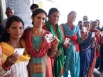 Women voters stand in queue
Women voters stand in queue