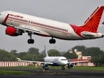 An Air India Airbus A320-200 aircraft takes off as an IndiGo Airlines aircraft waits for clearance at Ahmedabad airport. (REUTERS FILE PHOTO)