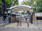 Security personnel stand guard outside the Enforcement Directorate (ED) office in New Delhi. Security personnel stand guard outside the Enforcement Directorate (ED) office in New Delhi.