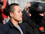 Police officers escort Terraform Labs co-founder Do Kwon after he served a sentence for document forgery, in Podgorica, Montenegro, March 23, 2024. REUTERS/Stevo Vasiljevic/File Photo