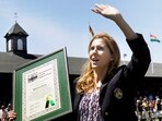 FILE - International Tennis Hall of Fame inductee Monica Seles waves to the crowd as she holds her plaque during ceremonies in Newport, R.I., July 11, 2009. (AP Photo/Elise Amendola, file) FILE - International Tennis Hall of Fame inductee Monica Seles waves to the crowd as she holds her plaque during ceremonies in Newport, R.I., July 11, 2009. (AP Photo/Elise Amendola, file)