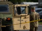 Members of the military stand guard alongside a military Humvee at the U.S. Park Police Anacostia Operations Facility Members of the military stand guard alongside a military Humvee at the U.S. Park Police Anacostia Operations Facility