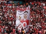 Liverpool fans with a banner in memory of Diogo Jota inside the stadium