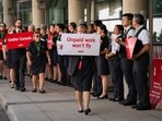 Air Canada flight attendants during a demonstration at Toronto Pearson International Airport in Mississauga, Ontario, Canada, on Monday, Aug. 11, 2025. Workers represented by the Canadian Union of Public Employees (CUPE), are holding a simultaneous action at airports in Montreal, Toronto, Vancouver, and Calgary, to raise awareness about ongoing issues related to their working conditions. Photographer: Arlyn McAdorey/Bloomberg