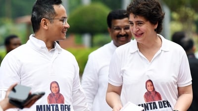 Congress MP Priyanka Gandhi Vadra and Deputy Leader of Congress in Lok Sabha Gaurav Gogoi, wearing T-shirts featuring the name Minta Devi (ANI)
