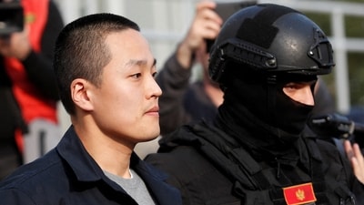 Police officers escort Terraform Labs co-founder Do Kwon after he served a sentence for document forgery, in Podgorica, Montenegro, March 23, 2024. REUTERS/Stevo Vasiljevic/File Photo (REUTERS)