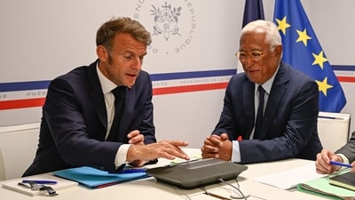 France's President Emmanuel Macron (L) and European Council President Antonio Costa, sitting next to France's Foreign Minister and France's Minister of Armed Forces (both unseen), attend a video conference on Ukraine from the Fort de Bregancon presidential holidays residence in Bormes-les-Mimosas, in southern France on August 13, 2025. (Photo by PHILIPPE MAGONI / POOL / AFP) (AFP) France's President Emmanuel Macron (L) and European Council President Antonio Costa, sitting next to France's Foreign Minister and France's Minister of Armed Forces (both unseen), attend a video conference on Ukraine from the Fort de Bregancon presidential holidays residence in Bormes-les-Mimosas, in southern France on August 13, 2025. (Photo by PHILIPPE MAGONI / POOL / AFP) (AFP)