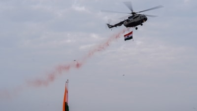 An Indian Air Force helicopter was seen showering flower petals during full dress rehearsal for at Red Fort complex (PTI) An Indian Air Force helicopter was seen showering flower petals during full dress rehearsal for at Red Fort complex (PTI)