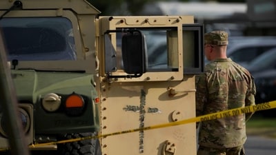 Members of the military stand guard alongside a military Humvee at the U.S. Park Police Anacostia Operations Facility (Getty Images via AFP) Members of the military stand guard alongside a military Humvee at the U.S. Park Police Anacostia Operations Facility (Getty Images via AFP)