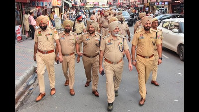 Police personnel during a flag march ahead of the Independence Day in Amritsar on Wednesday. (PTI) Police personnel during a flag march ahead of the Independence Day in Amritsar on Wednesday. (PTI)