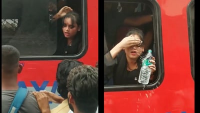 Girl struggles to breathe in an overcrowded train, tries to open the window, and splashes water. (Videograb/ANUR VNS ) Girl struggles to breathe in an overcrowded train, tries to open the window, and splashes water. (Videograb/ANUR VNS )