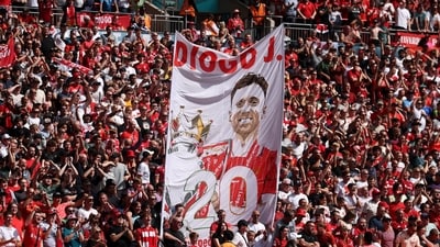 Liverpool fans with a banner in memory of Diogo Jota inside the stadium (REUTERS)