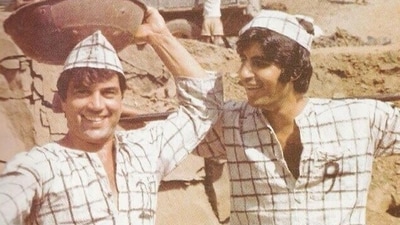 A candid moment between Dharmendra and Amitabh in the iconic jail scene from the beginning of Sholay. A candid moment between Dharmendra and Amitabh in the iconic jail scene from the beginning of Sholay. 
