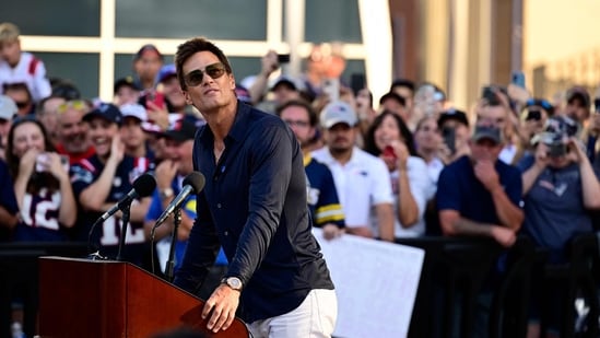 During the unveiling of his statue, Tom Brady emphasized teamwork and commitment to greatness, dismissing individual accolades. (Photo by Billie Weiss / GETTY IMAGES NORTH AMERICA / Getty Images via AFP) (Getty Images via AFP)