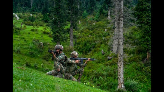 Indian Army jawans keep watch near the Line of Control in Uri sector of Baramulla district. (PTI)