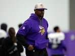 Minnesota Vikings defensive coordinator Brian Flores stands on the field during an NFL football workout in Eagan Minnesota Vikings defensive coordinator Brian Flores stands on the field during an NFL football workout in Eagan