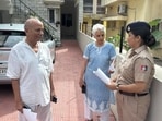 Cyber police sensitising elderly residents during a door-to-door awareness drive on digital arrest frauds in Chandigarh on Thursday. (HT Photo) Cyber police sensitising elderly residents during a door-to-door awareness drive on digital arrest frauds in Chandigarh on Thursday. (HT Photo)