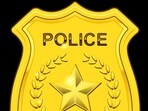 Gold Police Badge isolated on black background Gold Police Badge isolated on black background